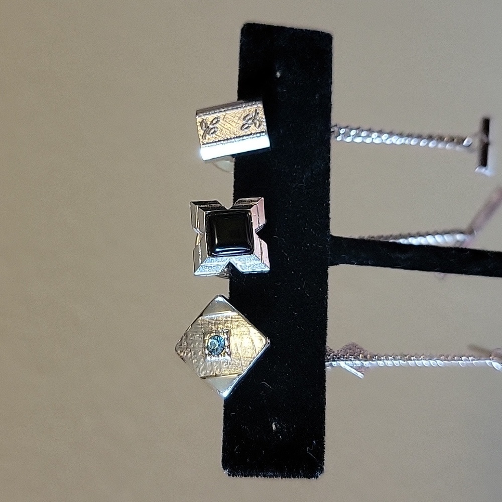 Three tie tacks